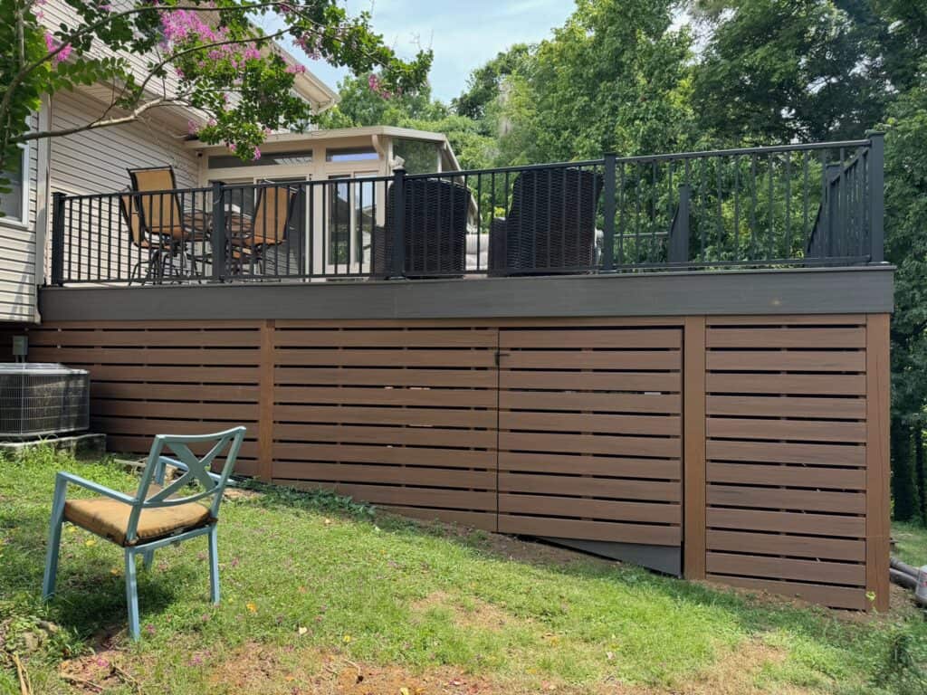 Custom outdoor deck with seating area and privacy screening, enhancing outdoor living spaces in Nashville, TN.