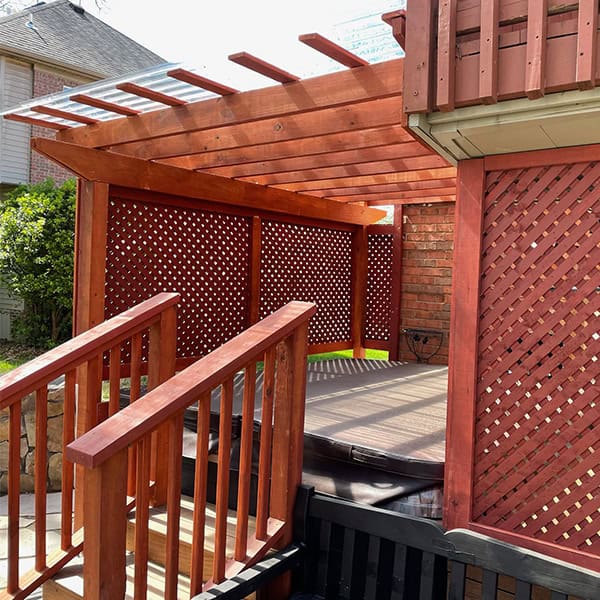 Custom wood pergola design with lattice side panels and stairs, enhancing outdoor living space for relaxation and comfort in Nashville, TN.