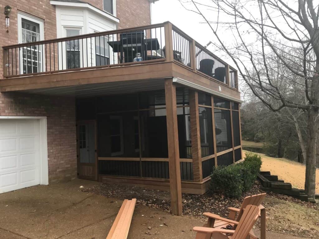 Custom-built outdoor living space featuring a wooden deck with a screened-in porch, showcasing quality craftsmanship by DW Construction in Nashville, TN.