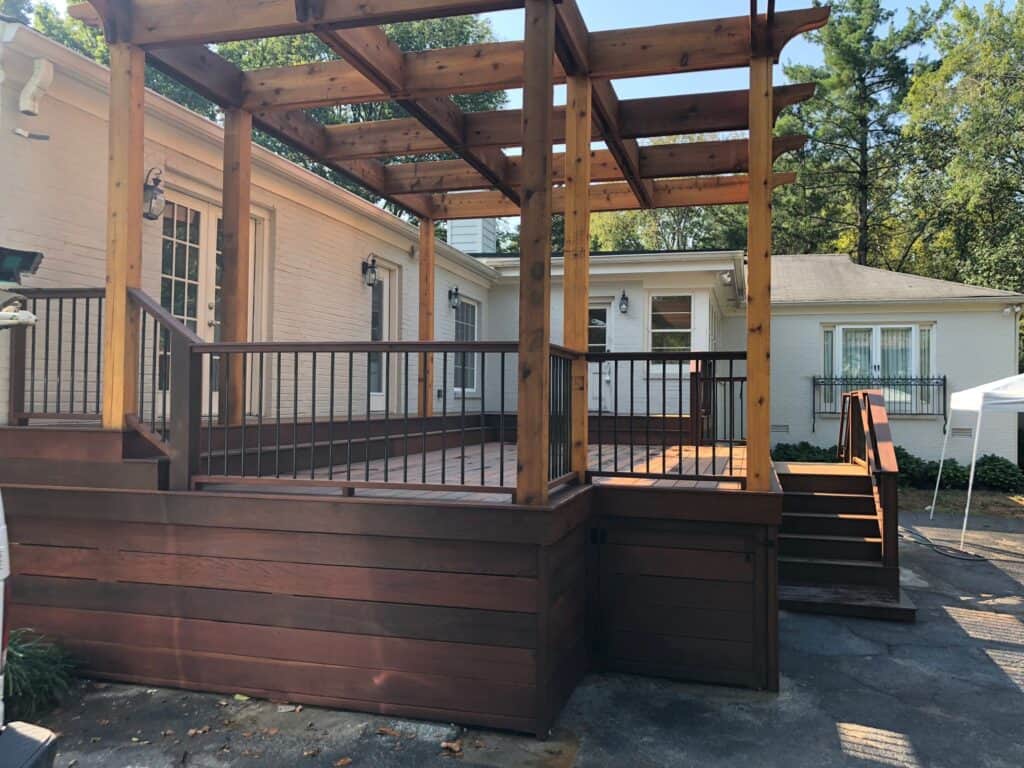 Custom wooden deck with pergola, showcasing outdoor living space designed by DW Construction in Nashville, TN.