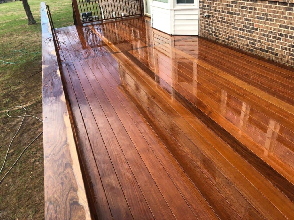 Wooden deck with a polished finish, showcasing high-quality materials, designed for outdoor living spaces in Nashville, TN.